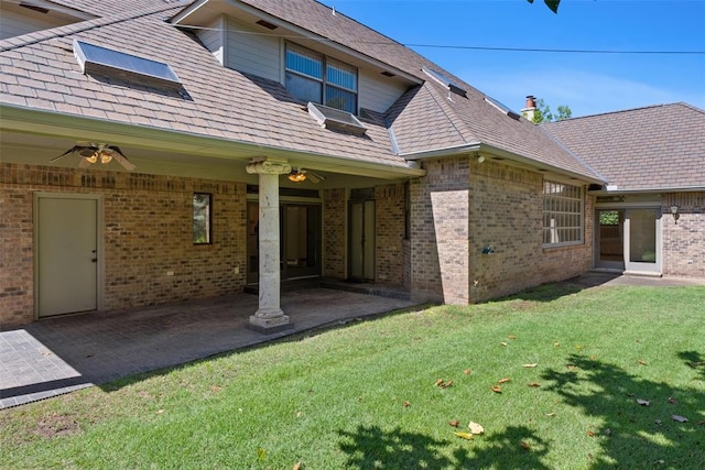 1409 Glenbrook Ter, Nichols Hills, OK 73116 - back of property with a lawn, a patio, and brick siding