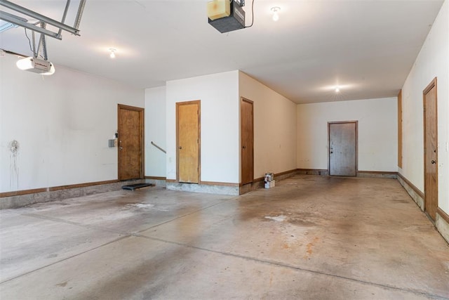 1409 Glenbrook Ter, Nichols Hills, OK 73116 - garage with a garage door opener and baseboards