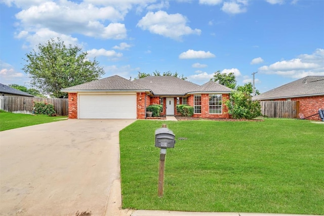 1101 Wendy Ln, Altus, OK 73521 - single story home featuring driveway, an attached garage, and brick siding