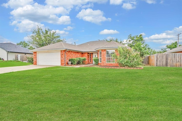1101 Wendy Ln, Altus, OK 73521 - single story home with an attached garage, brick siding, concrete driveway, and a shingled roof