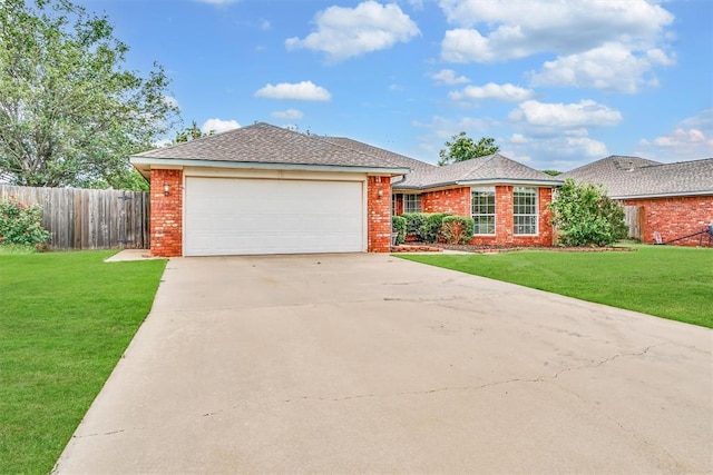 1101 Wendy Ln, Altus, OK 73521 - ranch-style house featuring an attached garage, driveway, and brick siding