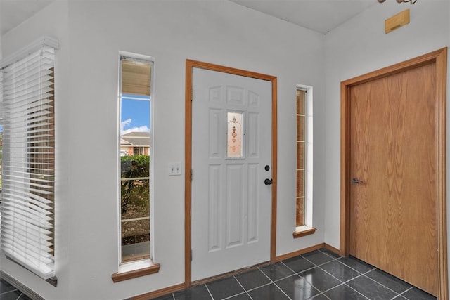 1101 Wendy Ln, Altus, OK 73521 - foyer with dark tile patterned floors and baseboards