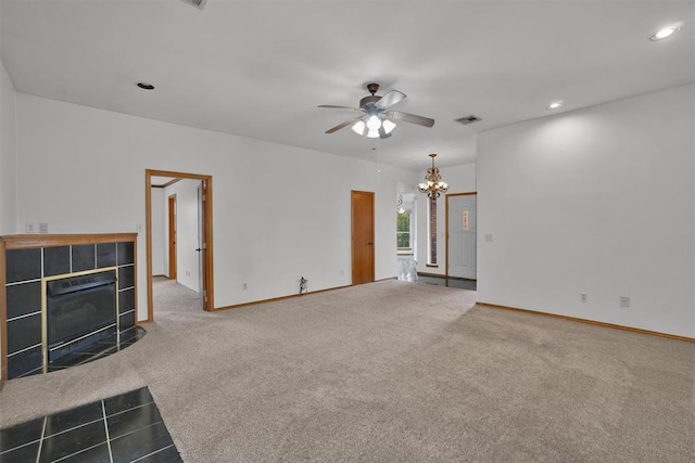 1101 Wendy Ln, Altus, OK 73521 - unfurnished living room with a chandelier, carpet, a ceiling fan, a tile fireplace, and recessed lighting
