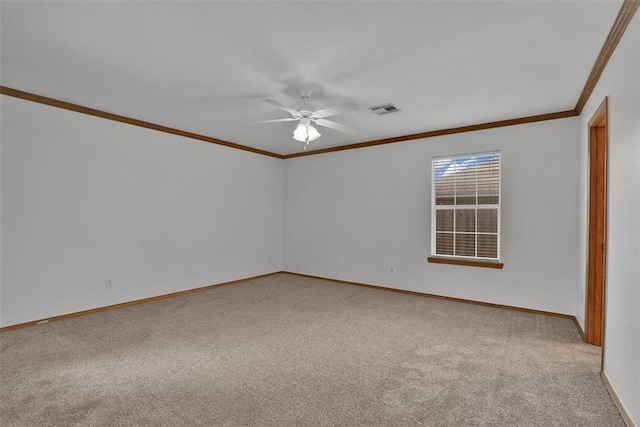 1101 Wendy Ln, Altus, OK 73521 - spare room featuring crown molding, carpet, baseboards, and ceiling fan