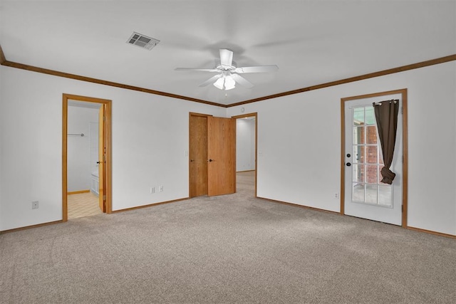 1101 Wendy Ln, Altus, OK 73521 - spare room featuring baseboards, carpet floors, a ceiling fan, and crown molding