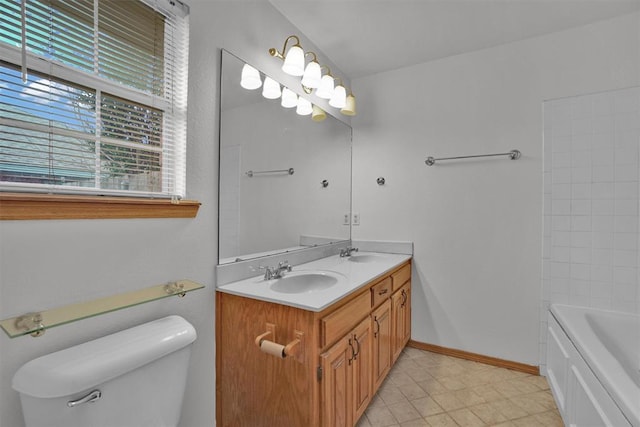 1101 Wendy Ln, Altus, OK 73521 - bathroom with toilet, double vanity, tile patterned floors, and baseboards
