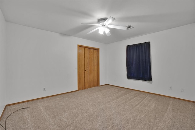 1101 Wendy Ln, Altus, OK 73521 - spare room with carpet flooring, a ceiling fan, and baseboards