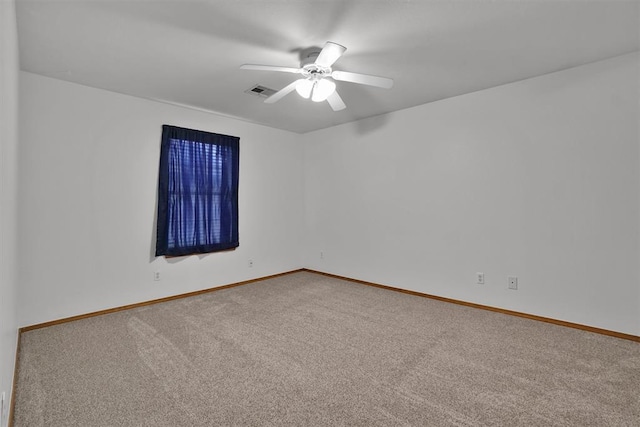 1101 Wendy Ln, Altus, OK 73521 - carpeted empty room with a ceiling fan and baseboards