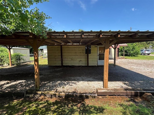 316 N Crenshaw St, Wayne, OK 73080 - view of parking featuring a carport
