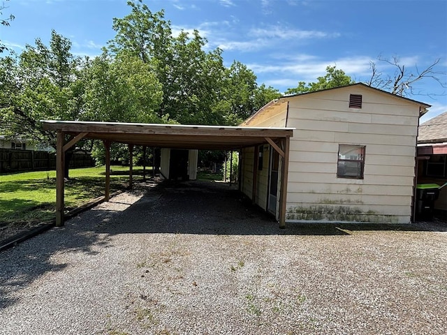 316 N Crenshaw St, Wayne, OK 73080 - view of vehicle parking featuring driveway and a carport