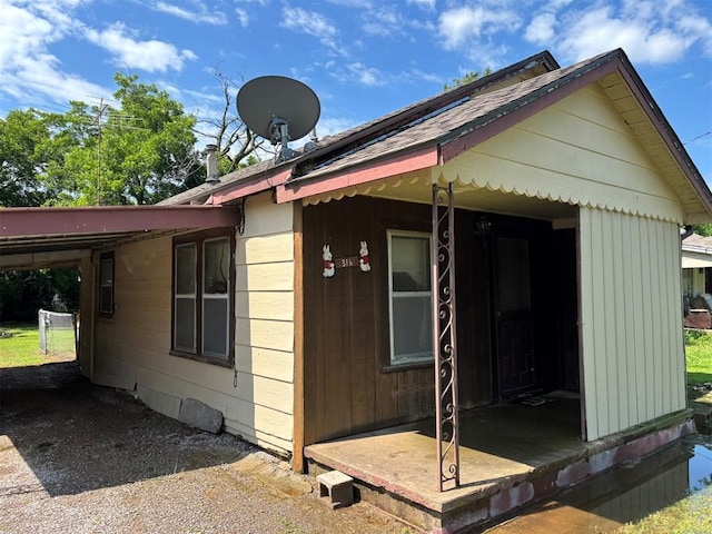 316 N Crenshaw St, Wayne, OK 73080 - view of side of home with an attached carport