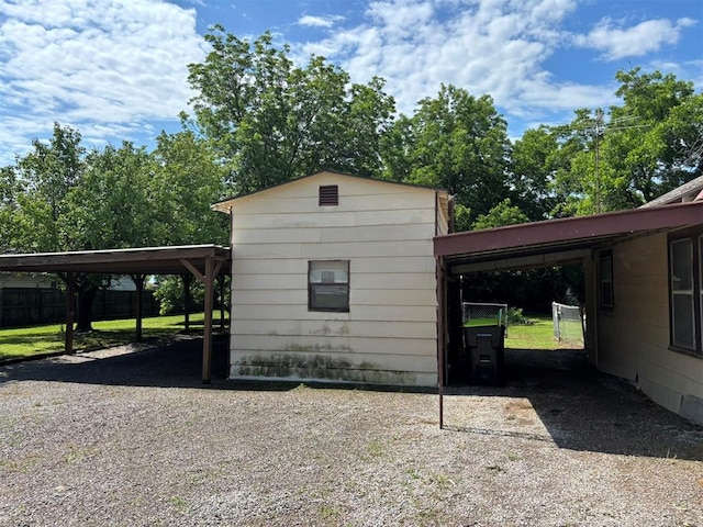 316 N Crenshaw St, Wayne, OK 73080 - view of side of home with driveway and a carport