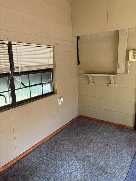 316 N Crenshaw St, Wayne, OK 73080 - carpeted spare room featuring baseboards