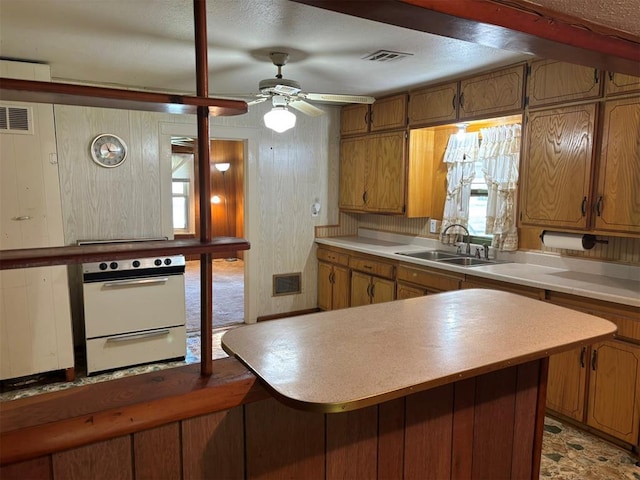 316 N Crenshaw St, Wayne, OK 73080 - kitchen featuring a sink, oven, ceiling fan, light countertops, and a warming drawer