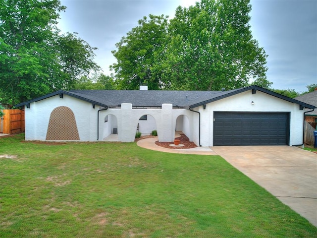 10109 Bison Cir, Yukon, OK 73099 - ranch-style house featuring concrete driveway, stucco siding, and a garage