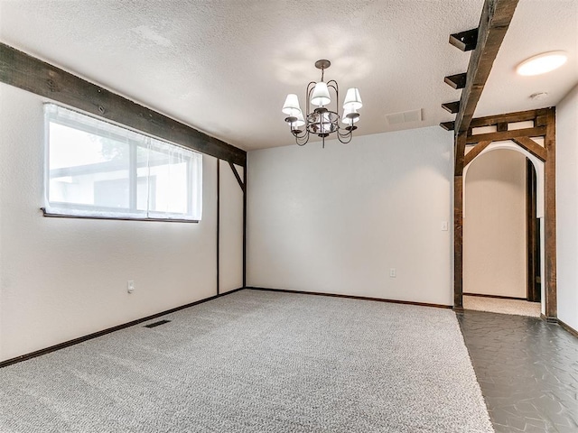 10109 Bison Cir, Yukon, OK 73099 - unfurnished room featuring a textured ceiling, a chandelier, and baseboards