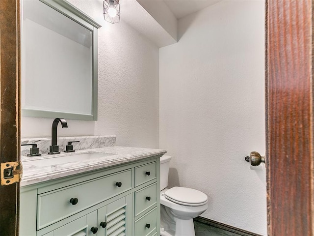 10109 Bison Cir, Yukon, OK 73099 - half bath with toilet, vanity, and a textured wall