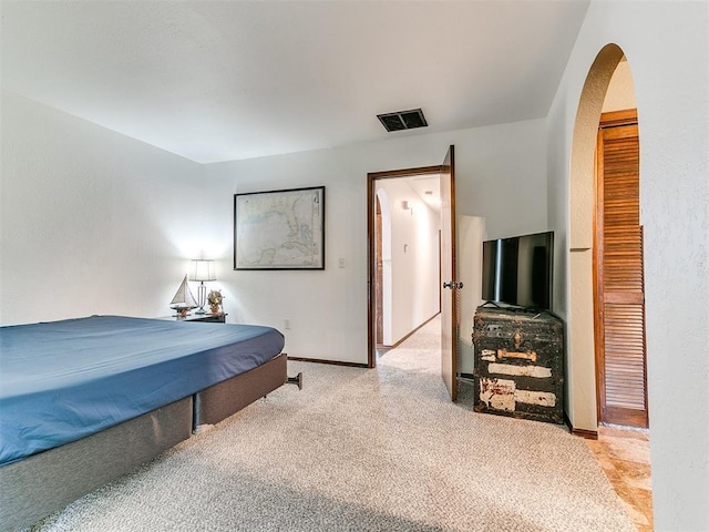10109 Bison Cir, Yukon, OK 73099 - bedroom with arched walkways, carpet flooring, and baseboards