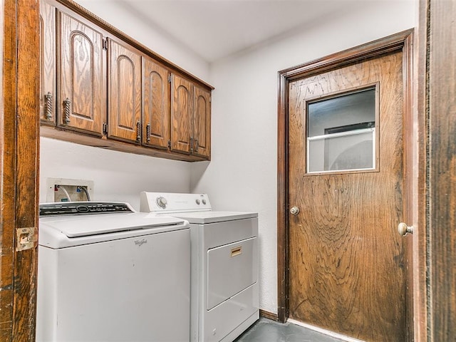 10109 Bison Cir, Yukon, OK 73099 - laundry room with washing machine and clothes dryer and cabinet space