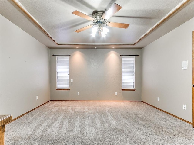 12104 Cantle Rd, Oklahoma City, OK 73120 - carpeted spare room featuring a raised ceiling, ceiling fan, and baseboards