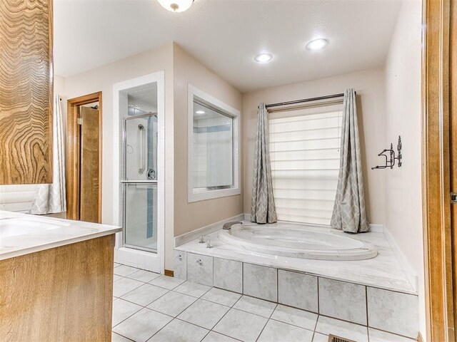12104 Cantle Rd, Oklahoma City, OK 73120 - bathroom with a garden tub, tile patterned flooring, a stall shower, recessed lighting, and vanity