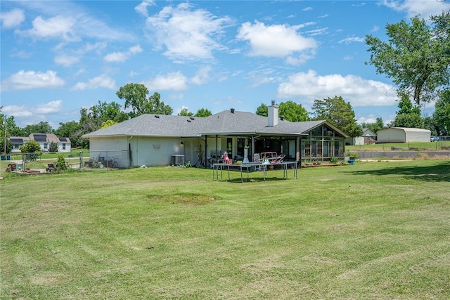 11110 Jeffords Ave, Choctaw, OK 73020 - back of house featuring a trampoline, a chimney, a sunroom, and cooling unit