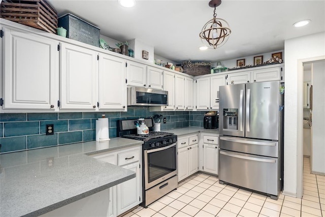 11110 Jeffords Ave, Choctaw, OK 73020 - kitchen with appliances with stainless steel finishes, light countertops, backsplash, white cabinets, and recessed lighting