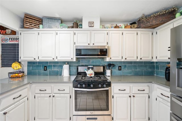 11110 Jeffords Ave, Choctaw, OK 73020 - kitchen featuring stainless steel appliances, white cabinets, tasteful backsplash, and light stone counters
