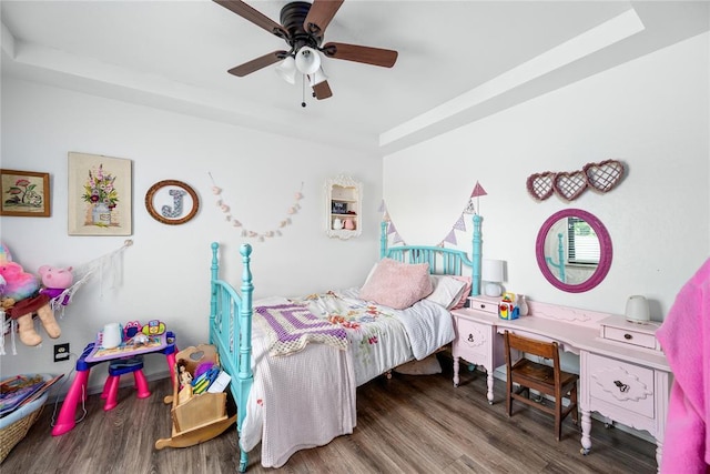 11110 Jeffords Ave, Choctaw, OK 73020 - bedroom featuring a tray ceiling, wood finished floors, and a ceiling fan