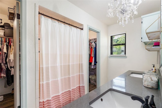 11110 Jeffords Ave, Choctaw, OK 73020 - full bath with a chandelier, a walk in closet, vanity, and a shower with shower curtain