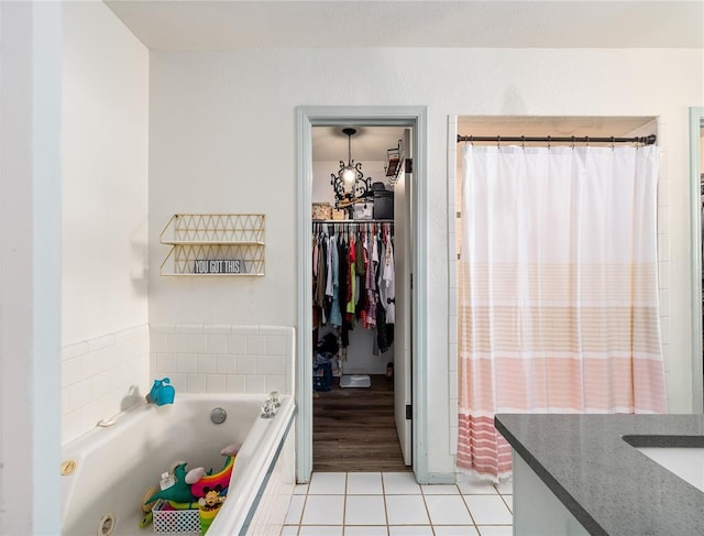 11110 Jeffords Ave, Choctaw, OK 73020 - full bath featuring tile patterned flooring, a garden tub, vanity, a walk in closet, and curtained shower