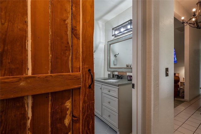11110 Jeffords Ave, Choctaw, OK 73020 - bathroom with tile patterned floors, vanity, and a chandelier