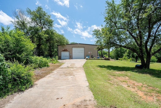 11110 Jeffords Ave, Choctaw, OK 73020 - view of front facade with a front yard, an outbuilding, and a detached garage