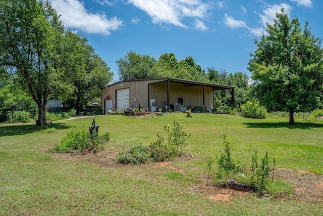 11110 Jeffords Ave, Choctaw, OK 73020 - view of green lawn featuring a detached garage, an outdoor structure, and a pole building