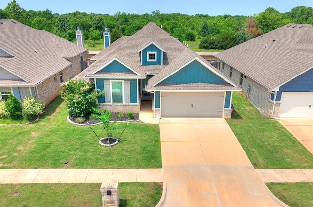 3909 Palisade Ln, Oklahoma City, OK 73179 - craftsman house with brick siding, an attached garage, roof with shingles, driveway, and a front yard