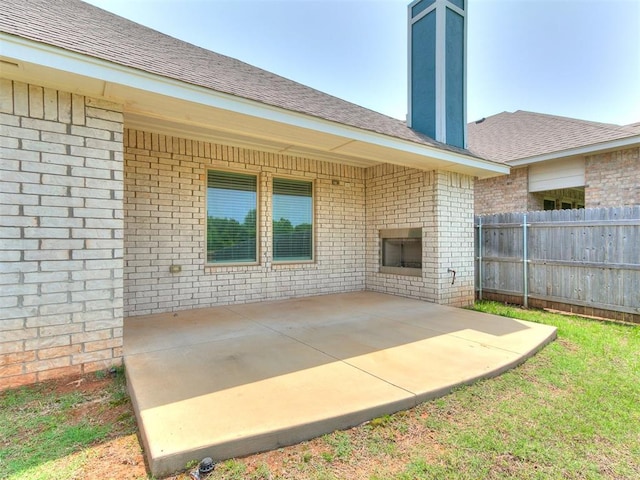 3909 Palisade Ln, Oklahoma City, OK 73179 - view of patio / terrace featuring a fireplace