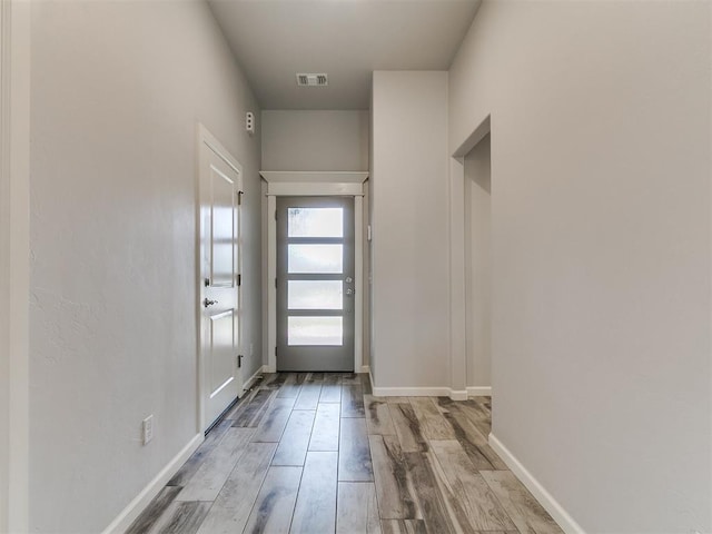3909 Palisade Ln, Oklahoma City, OK 73179 - doorway to outside with wood finished floors and baseboards