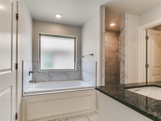 3909 Palisade Ln, Oklahoma City, OK 73179 - full bath featuring marble finish floors, a garden tub, vanity, and recessed lighting