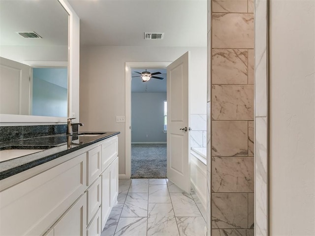 3909 Palisade Ln, Oklahoma City, OK 73179 - full bath with marble finish flooring, vanity, ceiling fan, and baseboards