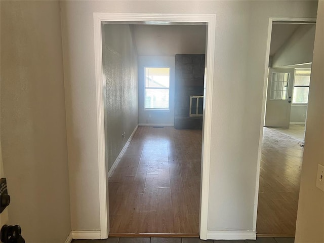 74 Fox Run Cir, Jenks, OK 74037 - hallway featuring baseboards, plenty of natural light, and wood finished floors