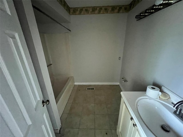 74 Fox Run Cir, Jenks, OK 74037 - bathroom with tile patterned flooring, vanity, a shower, baseboards, and a bath