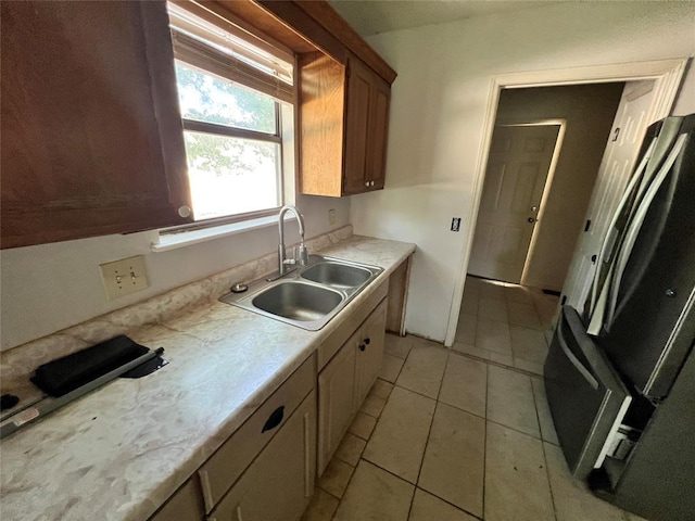 74 Fox Run Cir, Jenks, OK 74037 - kitchen with a sink, light countertops, and light tile patterned floors