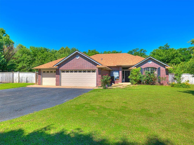 7705 Dripping Springs Ln, Oklahoma City, OK 73150 - single story home with brick siding, a garage, and asphalt driveway