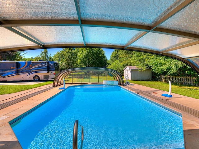 7705 Dripping Springs Ln, Oklahoma City, OK 73150 - swimming pool with a storage shed and a patio