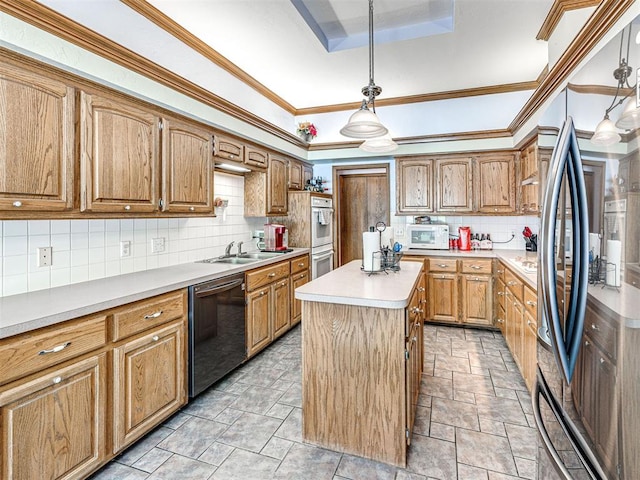 7705 Dripping Springs Ln, Oklahoma City, OK 73150 - kitchen with white appliances, a tray ceiling, backsplash, light countertops, and a center island