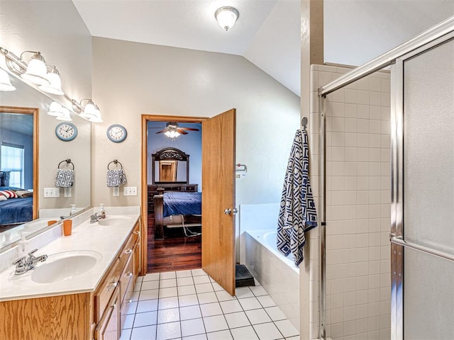 7705 Dripping Springs Ln, Oklahoma City, OK 73150 - ensuite bathroom featuring double vanity, a bath, tile patterned flooring, lofted ceiling, and a shower stall