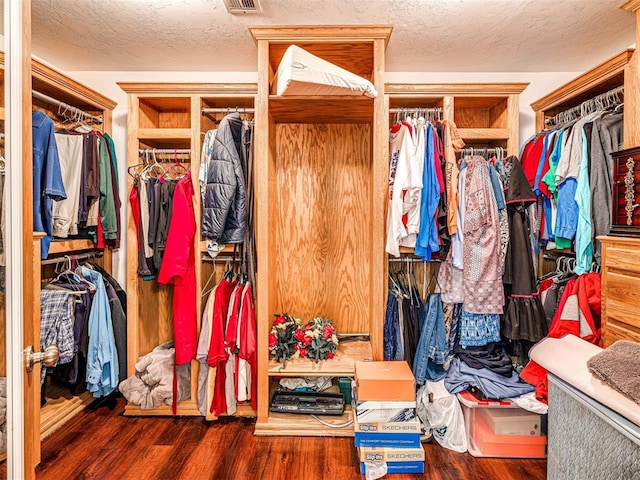 7705 Dripping Springs Ln, Oklahoma City, OK 73150 - walk in closet featuring wood finished floors