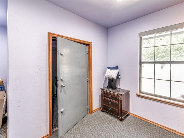 7705 Dripping Springs Ln, Oklahoma City, OK 73150 - entryway featuring carpet and baseboards