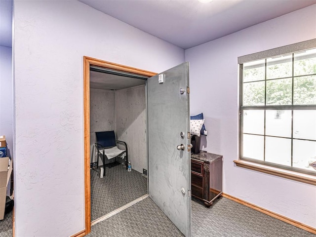 7705 Dripping Springs Ln, Oklahoma City, OK 73150 - corridor featuring carpet flooring