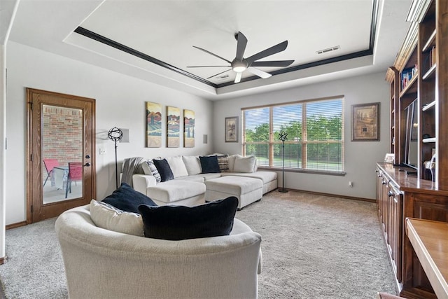 2528 E Bradley St, Shawnee, OK 74804 - living room with a raised ceiling, light carpet, a ceiling fan, and baseboards